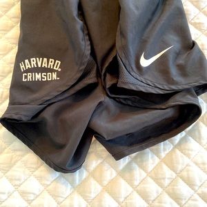 NIKE dry fit running shorts. Unisex M. Harvard branded logo.